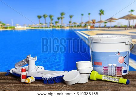 Equipment With Chemical Cleaning Products And Tools For The Maintenance Of The Swimming Pool.