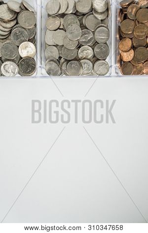 Organized Loose Coin Change On Top Side, Blank Empty Room Space For Text Bottom