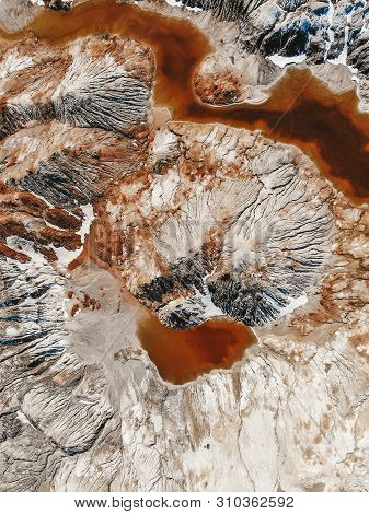 Clay Open Quarry Mars Landscape With Orange Water. Abandoned Rock Texture Old Porcelain Pit Mine In 