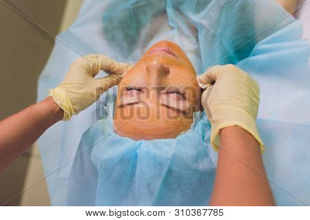 Aged Woman Doing Mesothreads And Thread Lifting, Cosmetology. Cosmetic Procedure To Eliminate Signs 