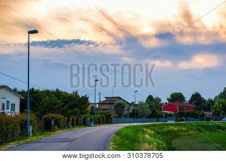 Rovigo, Italy - July, 2, 2019: people joging in Rovigo at sunset
