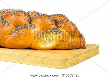 Closeup Of Fresh Whole Challah Bread On Chopping Board Isolated On White Background With Clipping Pa