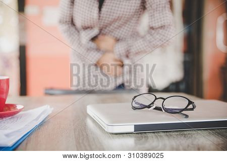 Business Woman Feeling Painful From Stomachache Illness During Working At Office, Hands Touching Her