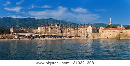 Budva, Montenegro - July 29, 2017: View Of The Old Budva And The Cozy Beach 