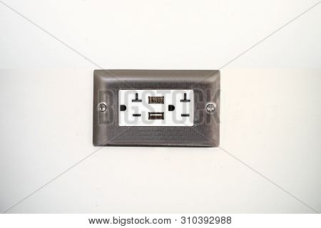 Ac Power Plug  Outlet Type B And Usb On The White Wall Of An Airport In The Usa