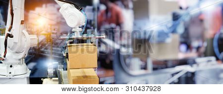 Industrial Robot Arm Control Holding Package Box. Banner Background For Operating Of Robot Machine I