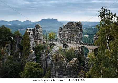 View Of Bastei Bridge And Lilienstein Plateau. Mountain Landscape. Traveling In East Germany.