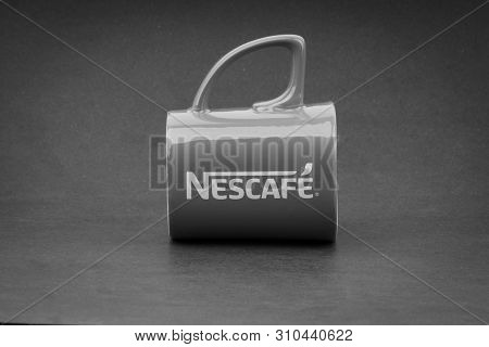Kuala Lumpur, Malaysia - July 03, 2019; Promotional Red Nescafe Mug On Black And White.  Selective F