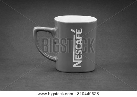 Kuala Lumpur, Malaysia - July 03, 2019; Promotional Red Nescafe Mug On Black And White.  Selective F