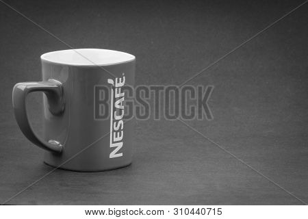 Kuala Lumpur, Malaysia - July 03, 2019; Promotional Red Nescafe Mug On Black And White.  Selective F