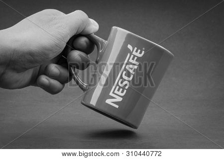 Kuala Lumpur, Malaysia - July 03, 2019; Promotional Red Nescafe Mug On Black And White.  Selective F
