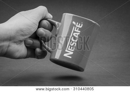 Kuala Lumpur, Malaysia - July 03, 2019; Promotional Red Nescafe Mug On Black And White.  Selective F