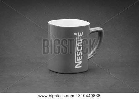 Kuala Lumpur, Malaysia - July 03, 2019; Promotional Red Nescafe Mug On Black And White.  Selective F