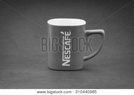 Kuala Lumpur, Malaysia - July 03, 2019; Promotional Red Nescafe Mug On Black And White.  Selective F