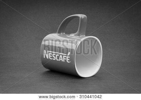 Kuala Lumpur, Malaysia - July 03, 2019; Promotional Red Nescafe Mug On Black And White.  Selective F