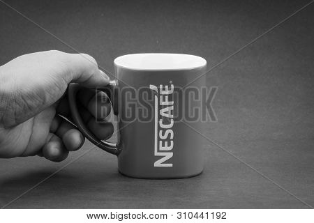 Kuala Lumpur, Malaysia - July 03, 2019; Promotional Red Nescafe Mug On Black And White.  Selective F