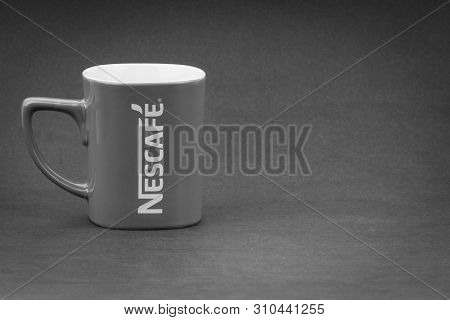 Kuala Lumpur, Malaysia - July 03, 2019; Promotional Red Nescafe Mug On Black And White.  Selective F