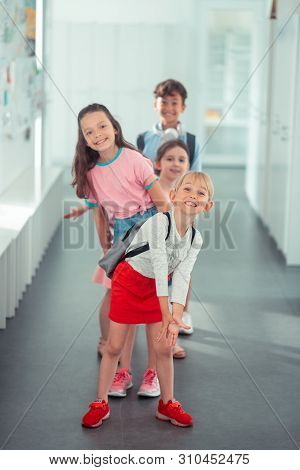 Girls And One Boy Having Fun During School Break