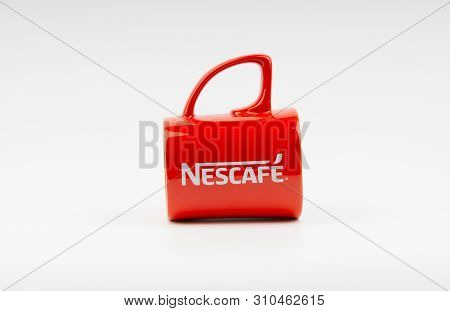 Kuala Lumpur, Malaysia - July 03, 2019:  Promotional Red Nescafe Mug On White Background. Selective 