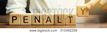 A Man Puts A Wooden Blocks With The Word Penalty. Fine As A Punishment For A Crime And Offense. Viol
