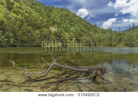Idyllic Landscape Of Myojin Pond At Hotaka Rear Shrine In Kamikochi, Nagano, Japan.