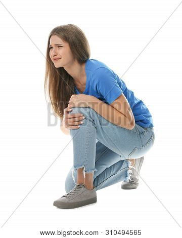 Full Length Portrait Of Woman Having Knee Problems On White Background