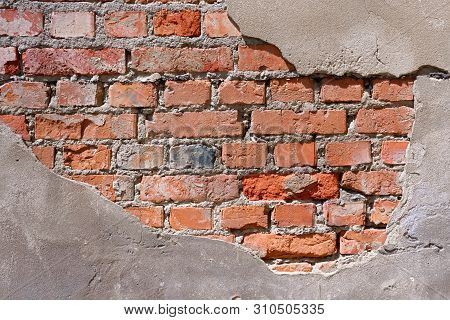 Dilapidated Red Brick Wall On Which Plaster Fell Off (fragment)