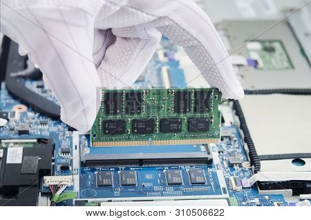 Repairman Working In Technical Support Fixing Computer Laptop Tr. Disassembled Modern Ultrabook With