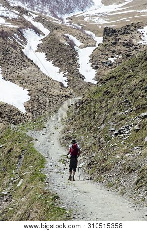 View At Young Hiker With Traditional Papakha Fur Hat At High Latitude Mountains At Mtskheta-mtianeti