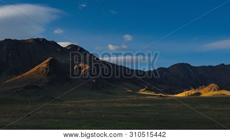 Russia. Mountain Altai. The Surrounding Mountains Regional Center Onguday Along Tchuisky Highway.