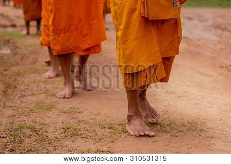 There Was A Merit Making In The Morning. People Would Scoop Food Into The Alms Of Many Monks.