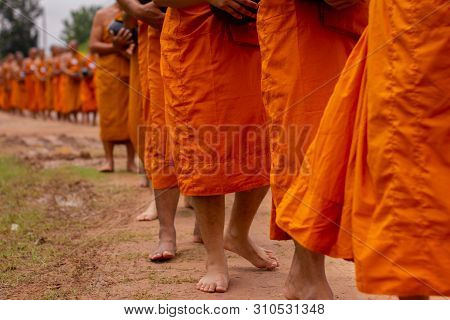 There Was A Merit Making In The Morning. People Would Scoop Food Into The Alms Of Many Monks.