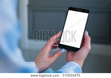 Mock Up, Copyspace, Template And Technology Concept. Woman Looking At Black Smartphone With White Bl