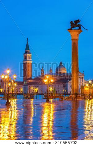 Piazza San Marco at night, view on venetian lion and san giorgio maggiore, Vinice, Italy