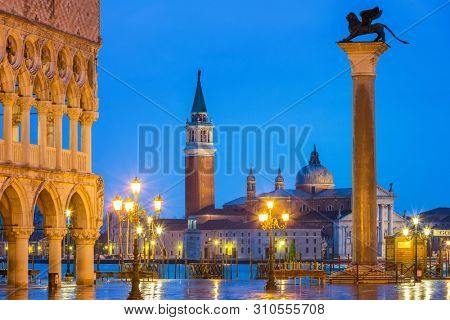 Piazza San Marco at night, view on venetian lion and san giorgio maggiore, Vinice, Italy