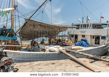 Makassar, Sulawesi, Indonesia - February 28, 2019: Paotere Old Port. Men Take A Break From Manually 