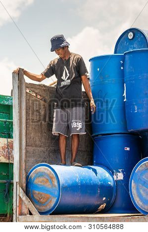 Makassar, Sulawesi, Indonesia - February 28, 2019: Paotere Old Port. Closeup Of Dock Worker Standing