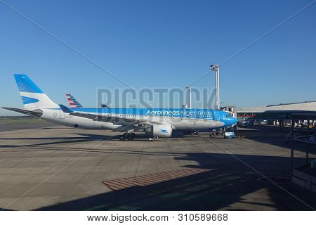 Buenos Aires/argentina-5/24/19: The Exterior Side View Of An Aerolineas Airplane Sitting On The Tarm