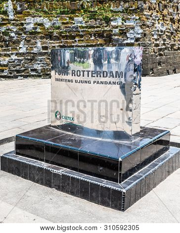 Makassar, Sulawesi, Indonesia - February 28, 2019: Fort Rotterdam. Shiny Metal Sign Sponsored By Cal