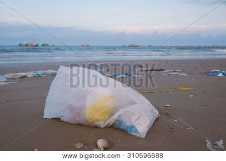 Trash, Plastic, Garbage, Bottle... Environmental Pollution On Sandy Beach. Royalty High-quality Stoc