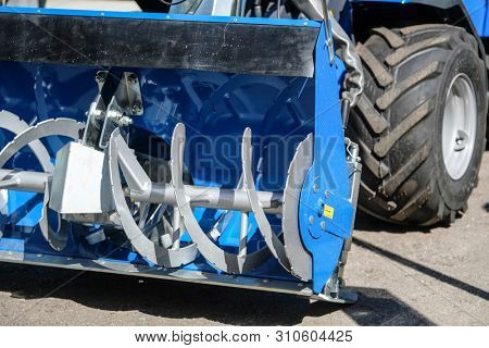 Image of a part of snow-removal mini tractor