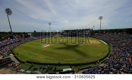 LEEDS, ENGLAND. 04 JULY 2019: A general view as a Jet2 plane heading for Leeds Bradford airport casts a shadow across the pitch during the Afghanistan v West Indies, ICC Cricket World Cup match