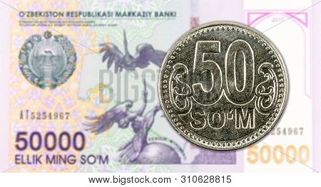 50 Uzbek Som Coin Against 50000 Uzbek Som Banknote