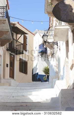 Stairs In The Narrow Street Of Neorio Town On Poros Island, Greece; Summer Background