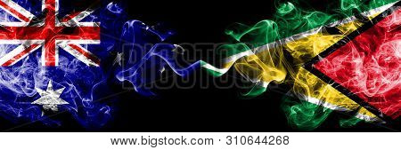 Australia Vs Guyana, Guyanese Smoky Mystic Flags Placed Side By Side. Thick Colored Silky Smokes Com