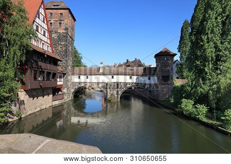 Nuremberg City, Germany - Wasserturm Medieval Tower, Henkersteg Bridge And Henkerhaus.