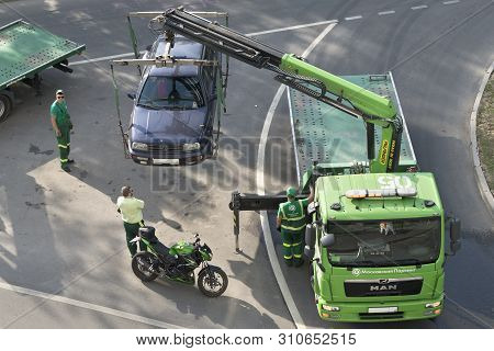 Loading And Towing A Car For The Wrong Parking. Moscow / Russia - May 2019. Image Can Be Used For To
