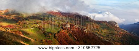 aerial view of Carpathian mountains countryside in autumn morning, Romania