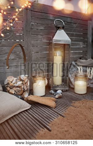 Evening Atmosphere On A Summer Terrace With Mediterranean Decoration For Leisure And Relaxation And 