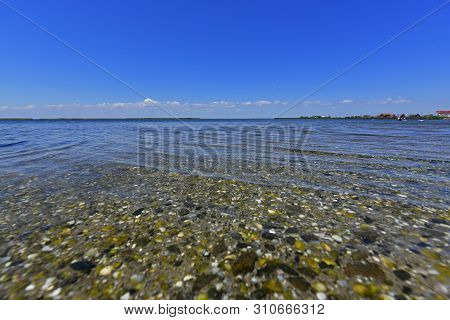 Calm In The Sea Bay. Berdyansk Spit Is Located In The North Of The Azov Sea, Separating The Gulf Of 